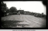 Grey house with flagpole