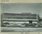 Automobiles parked on street by new Communications Center, The University of Iowa, July 1953