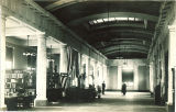 Men in a corridor of the Gilmore Hall law library, the University of Iowa, between 1915 and 1920
