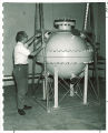 Physics student with space probe, The University of Iowa, 1960s