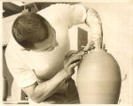 Art student throwing a clay pot, The University of Iowa, 1970