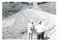 Soil Conservation Services surveying slope of earthen dam, 1967 