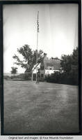White house with flagpole