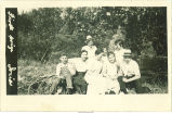 Men and women under tree, Ionia, Iowa, 1920s