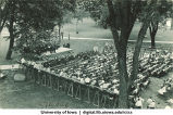 Crowd listening to speaker on dais, Class Day, The University of Iowa, 1920s