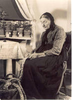 Woman braiding rug