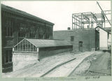 Plant house and other buildings adjacent to Calvin Hall, left, The University of Iowa, 1900s