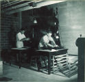 Students working with optical equipment and bright light, The University of Iowa, 1950s