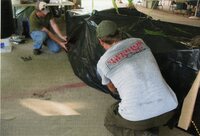 2010  Fair Booth Display table being set up by Caleb Waters, Mark Delperdang, and Jamie Grimes