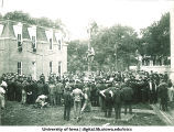 Pole climbing competition west of Old Capitol, The University of Iowa, ca. 1905.