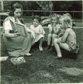 Woman reading to children outside, The University of Iowa, May 28, 1941