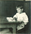Child playing with cards, The University of Iowa, ca. 1920