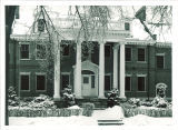 Front porch of the university president's house in winter, The University of Iowa, 1930s