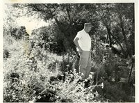 Man near a rock wall