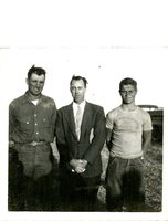 Three Men Stand in Cornfield