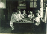Children playing at a sand table, The University of Iowa, ca. 1920