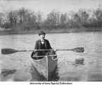 Man in canoe on Iowa River, Iowa City, Iowa, ca. 1890s