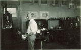 Art class watching a man paint at an easel, The University of Iowa, 1930s