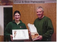 Staff holding doughnuts