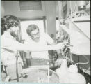Two researchers working with equipment, 1978