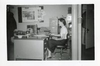 Side View of Woman at Office Desk