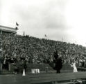 Cheerleader and Cy at Clyde Williams Field, Homecoming Game, 1957