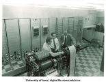 University officials survey Iowa test program data, The University of Iowa, 1950s