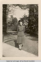 Woman in dress on sidewalk