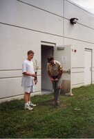 1999 Commissioner Jeff Bergman and student Kyle Law plant a tree