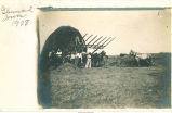 People and horses working in hayfield, Glenwood, Iowa, 1908