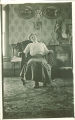 Woman posing in ornate rocking chair, Iowa, 1920s