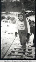Ski jumper ascending the hill