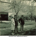 Officers standing in the shade near Armory, The University of Iowa, 1950s