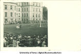 Women in costume dancing near a maypole on the Pentacrest lawn, The University of Iowa, June 1924