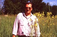 Eric Hoien Poses in Native CRP Field.