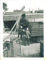 linograph machine being lifted onto truck, The University of Iowa, 1950s