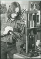 Researcher with hydraulic press, 1980