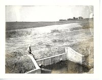 Construction of water control structure on Sonksen farmland.