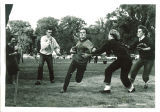 Kappa Kappa Gamma members playing football, The University of Iowa, 1960s
