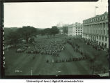 Induction ceremony crowd and procession to west of Maclean Hall, The University of Iowa, 1925