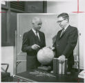 Earl O Heady and Leo V. Mayer discussing world economic development, 1966
