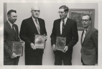 Men receiving Certificate of Merit Awards. 