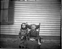 UP584 Two girls by house