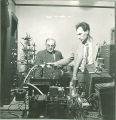 Glocker and Roberts working with laboratory equipment, The University of Iowa, 1950s