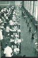 Dental students with patients in the infirmary clinic, The University of Iowa, 1940s