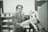 Professor examining data printout, 1973
