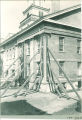 Scaffolding and support beams against the Old Capitol during reconstruction, The University of Iowa, September 1921