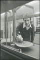 Researcher with balance scale, 1980.