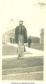 Student in mask and costume on the Pentacrest, Homecoming, The University of Iowa, 1917