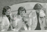 Homecoming Queen and attendants waving, 1951